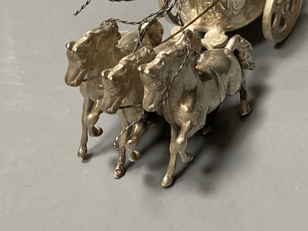 A matched set of three modern silver models of chariots with rider and horses, maker SMD, London, 1965/6, length 9cm, 8.5oz.